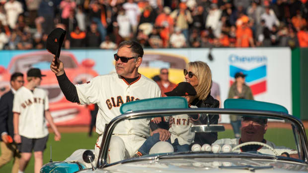 SF Giants manager Bruce Bochy (15) takes one last trip around the park to thank fans. (2019)